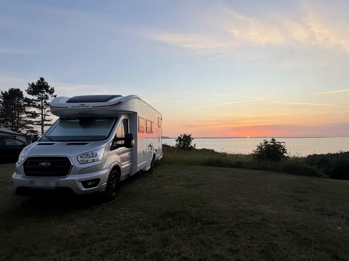 Motorhome on a panorama pitch at sunset over the Limfjord