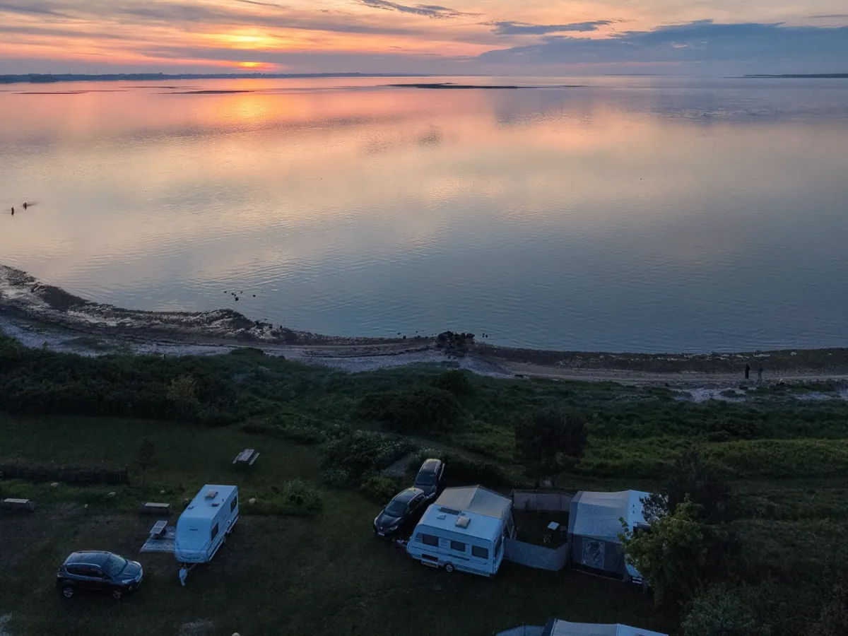 Caravans on the panorama pitches by the beach at sunset, seen from above