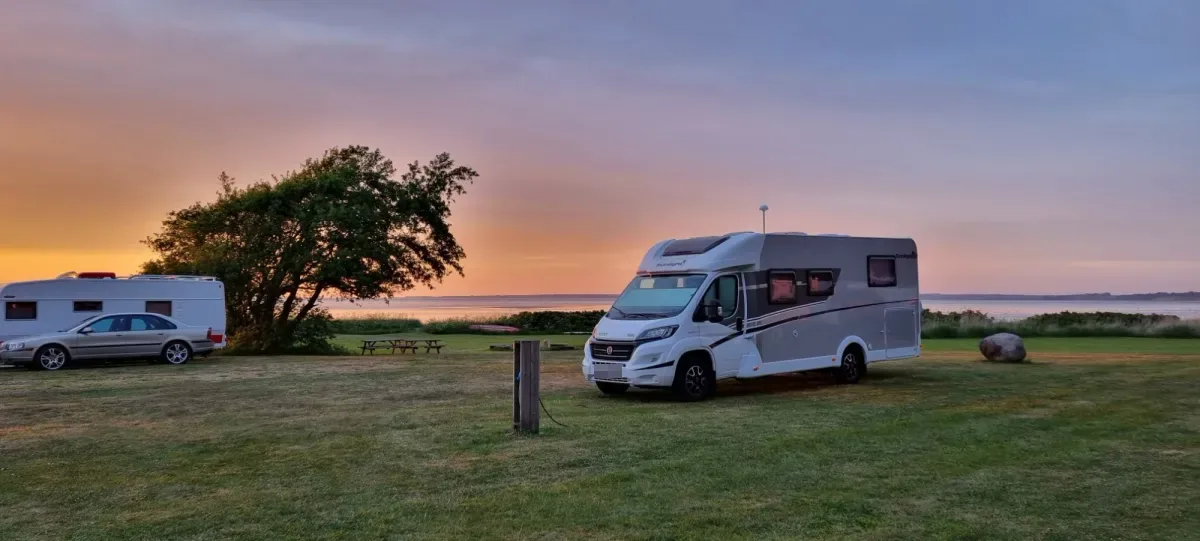 Motorhome at sunset on a view pitch by the Limfjord
